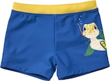 Badehose mit Schildkröten-Motiv, blau + gelb, Gr. 110/116 Angebote von PUSBLU bei dm-drogerie markt Gießen für 5,90 €