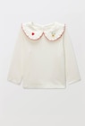 Blouse manches longues unie col brodé en coton BIO GOTS à 12,99 € dans le catalogue Monoprix Margaret
