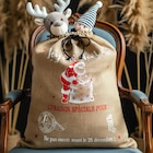 Toile effet jute imprimé sac cadeaux père Noël rouge 150 cm en promo chez Décor Discount Toile effet jute imprimé sac cadeaux père Noël rouge 150 cm dans le catalogue Décor Discount