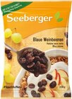 Blaue Weinbeeren oder Bananenchips im Angebot bei REWE in Augsburg Blaue Weinbeeren oder Bananenchips Angebote von Seeberger bei REWE Augsburg für 1,11 €