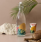 Bouteille avec clapet Paradis Exotique verre en promo chez Maxi Bazar Bouteille avec clapet Paradis Exotique verre dans le catalogue Maxi Bazar