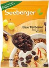Blaue Weinbeeren oder Bananenchips im Angebot bei REWE in Augsburg Blaue Weinbeeren oder Bananenchips Angebote von Seeberger bei REWE Augsburg für 1,11 €