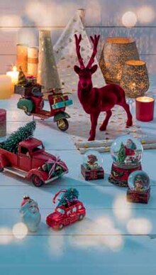 Schneekugel 'Teddy auf Geschenk'