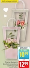 Frische Blumen in Geschenkverpackung mit Trägergriff Angebote bei E center Leonberg für 10,99 €