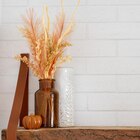 Tiges dans vase ambre en promo chez B&M Lyon à 9,99 €