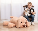 Peluche chien couché 76 cm - JouéClub Peluche chien couché 76 cm à 34,99 € dans le catalogue JouéClub
