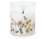 LED-Echtwachskerze im Glas mit Blumenprint bei Tchibo im Prospekt "" für 9,99 €