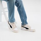 Tennis basses à lacets en cuir Puma sable homme en promo chez La Halle Tennis basses à lacets en cuir Puma sable homme dans le catalogue La Halle