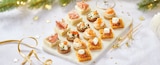 Promo 16 canapés traiteur à 10,99 € dans le catalogue Intermarché Super à Langres